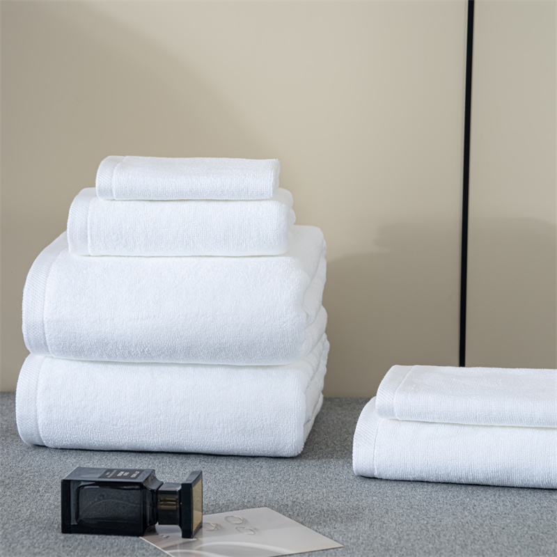 Hotel Towel Set Folded on Bed